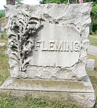 Fancy lilies carved on a Fleming family monument